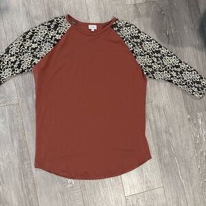LuLaRoe Randy Rust color Top with Black and White Floral Sleeves. 3/4 sleeves